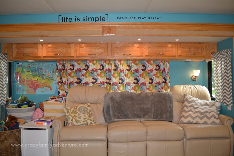 During the RV remodel, we removed some sections of the couch to make room for storage, painted the walls, and hung custom curtains