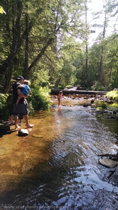 Walking on a water trail next to the falls.