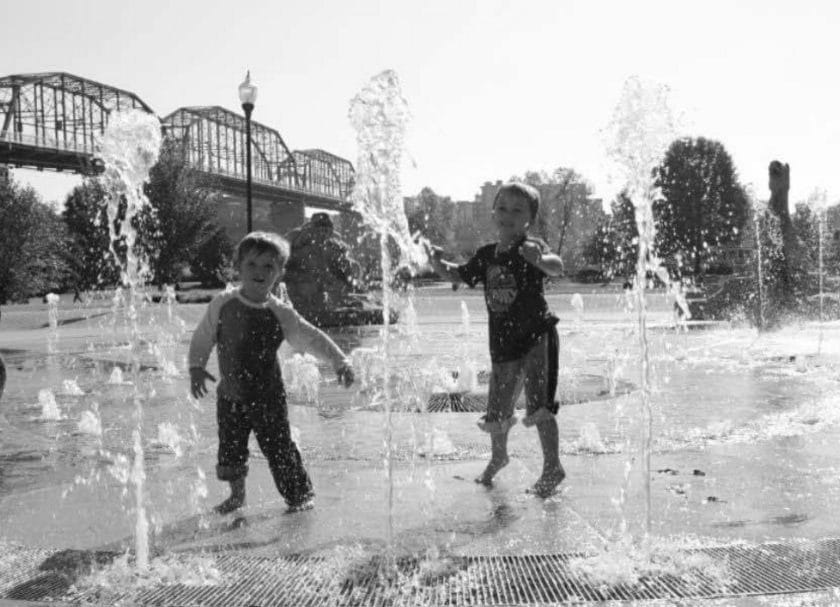Kids playing in the fountain at Coolidge Park, Things to do in Chattanooga with kids