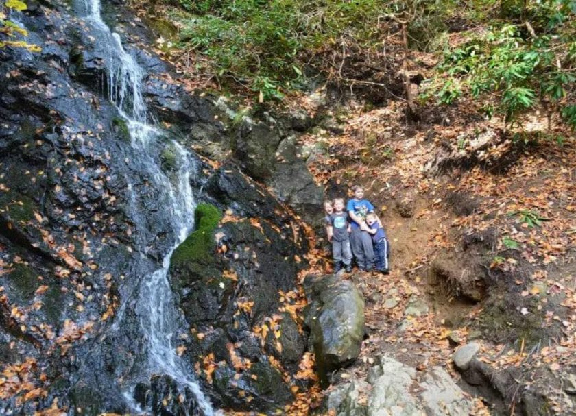 Kids by the waterfall, family fun in Gatlinburg