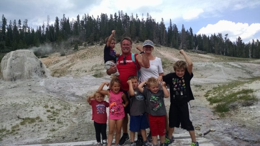 Kids with Nana and Boppa standing in front of the geyser.