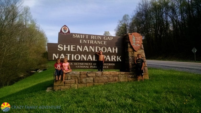 Picture of kids standing in front of the sign for Shenandoah National Park, East Coast Road Trip