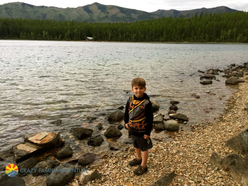 Knox skipping stones in Lake McDonald during our Rocky Point hike