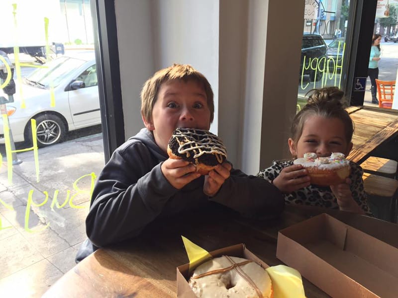 Kids eating their donuts at the Donut Bar. The Best Donuts in San Diego!
