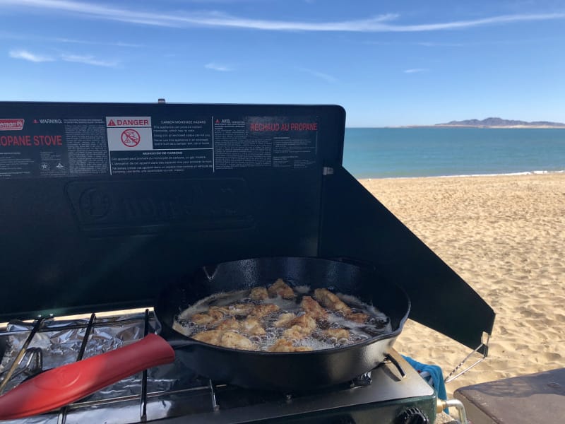 Grilling fish on the beach in San Felipe