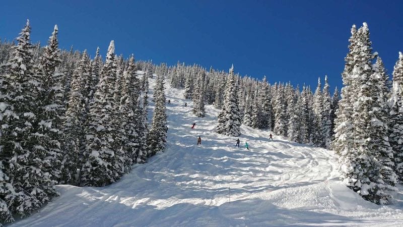 skiing down the mountain in Breckenridge, Best family ski resorts