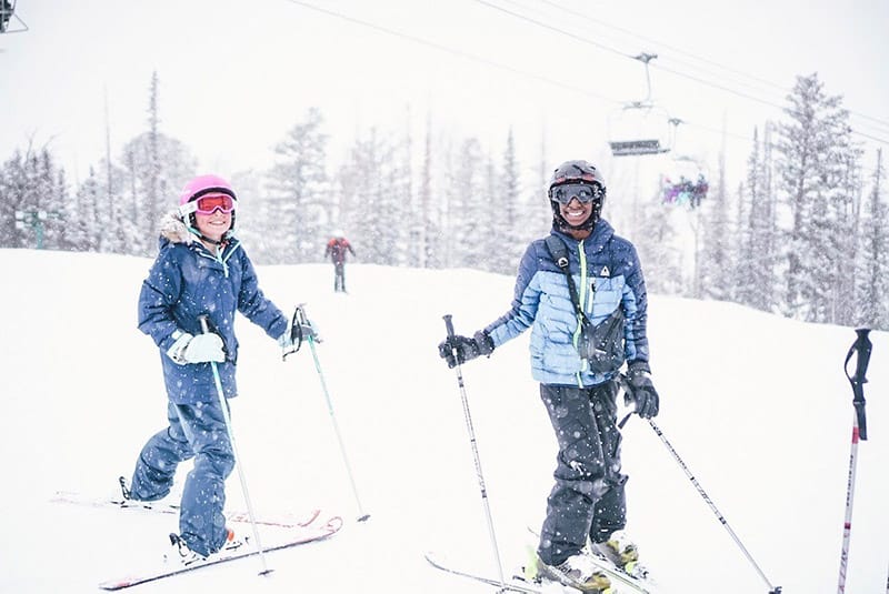 a couple skiing at Deer Valley, Best family ski resorts