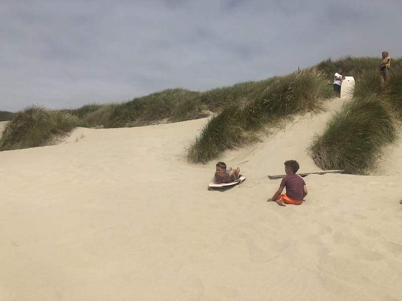 Playing on the sand dunes on the Oregon coast