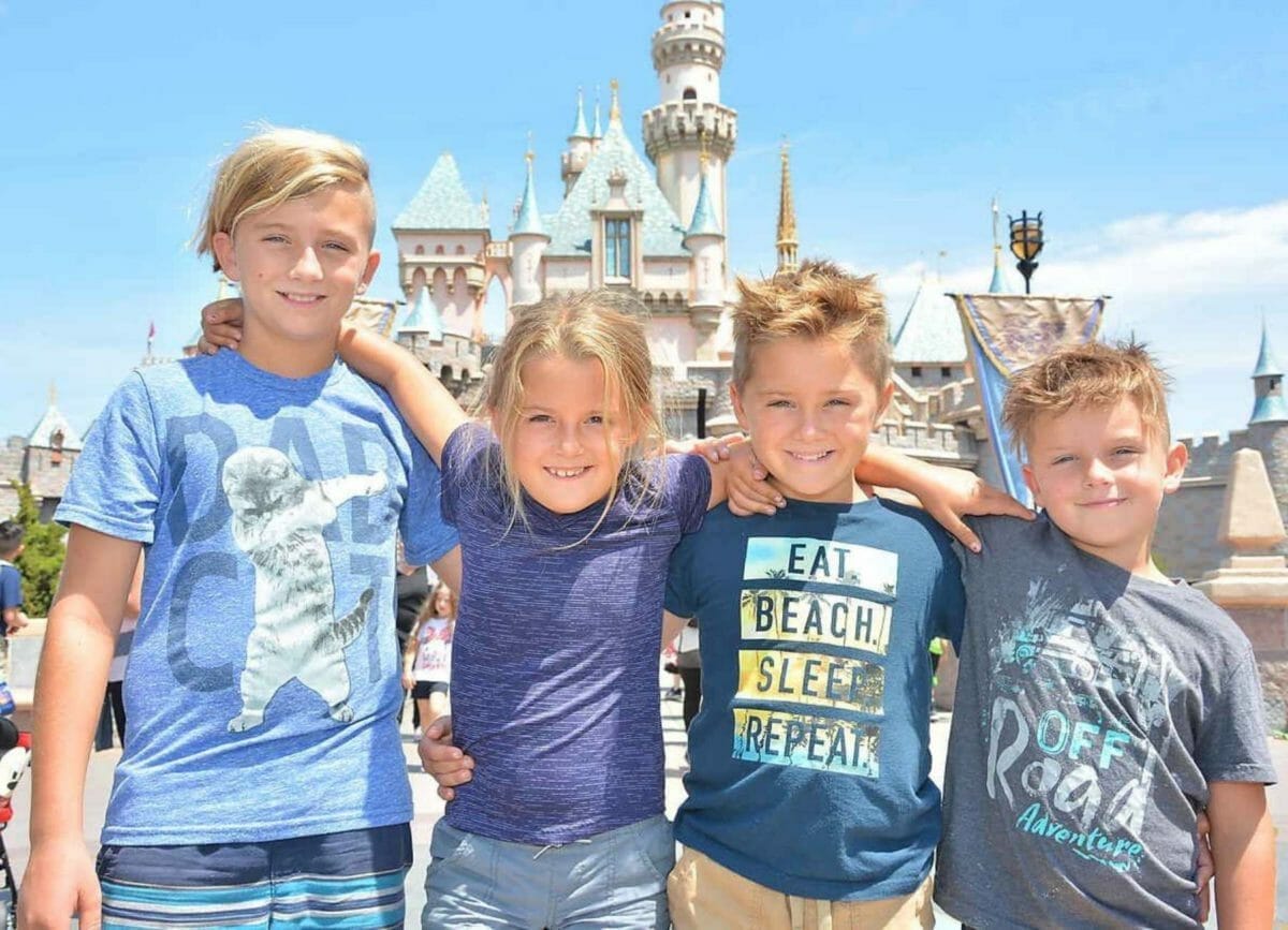 The kids in front of the Disneyland castle.