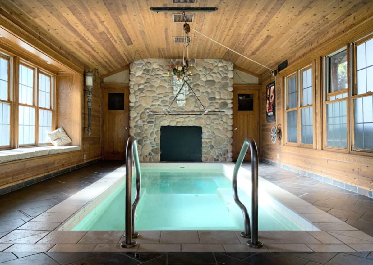 Shows an indoor pool next to a fireplace, Wisconsin Dells Vacation Rentals