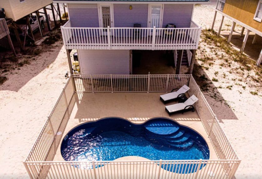 50 Shades of Blue, Gulf Shores, the pool and exterior view of both decks Best Gulf Shores Airbnb and VRBO Stays.