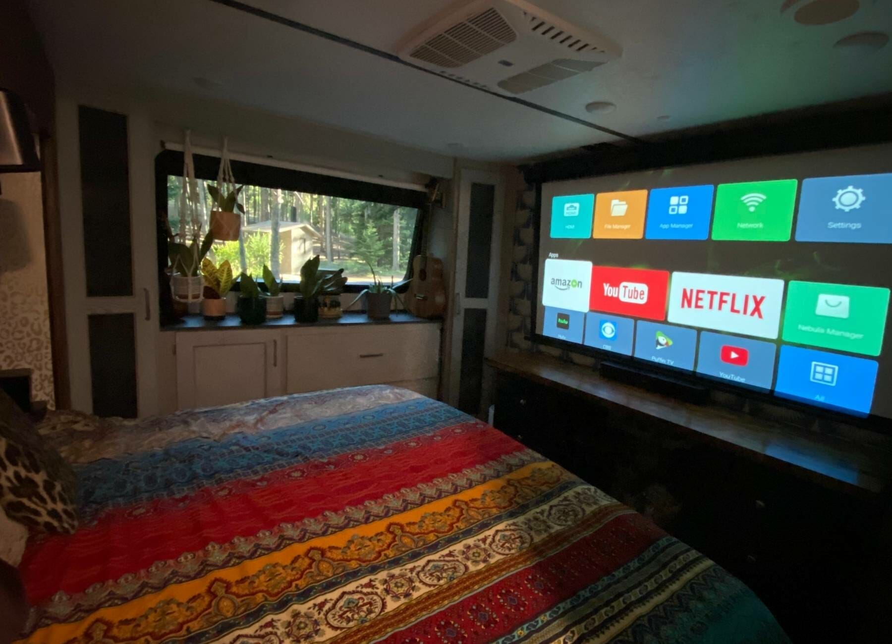 Projector screen down in the bedroom