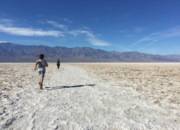 Shows a kid running across Death Valley,Things to do in Southern California