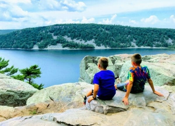 Shows 2 kids looking out at Devils Lake, Best camping in Wisconsin