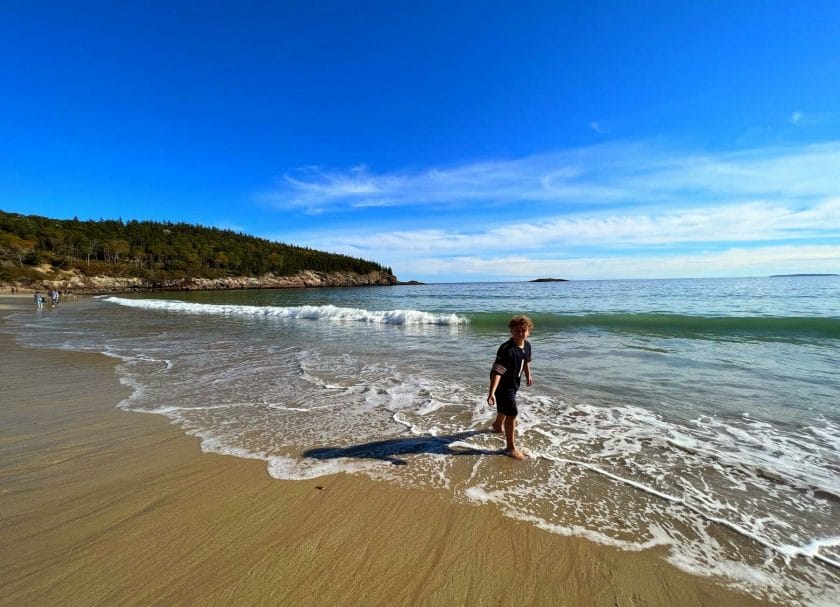 Playing in the water at Sand Beach - a fun thing to do in Acadia National Park