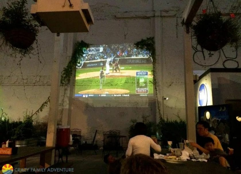 The projector in the beer garden at Moon River Brewery is great for things to do with kids in Savannah Georgia 