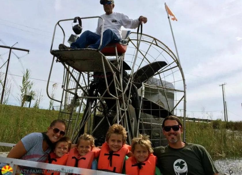 Shows a family of 5 enjoying a airboat tour, Things to do in Orlando