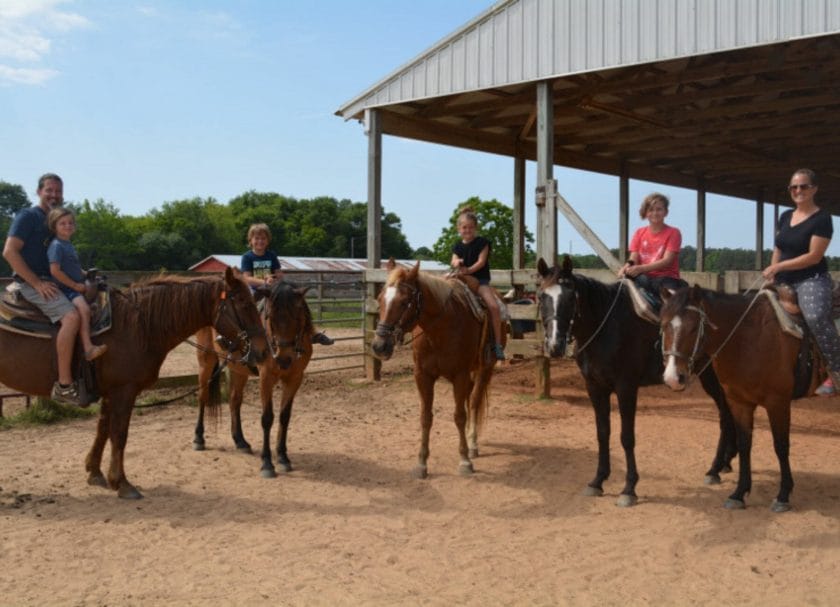 The whole family on horseback at Oak Hollow Farms, Gulf Shores