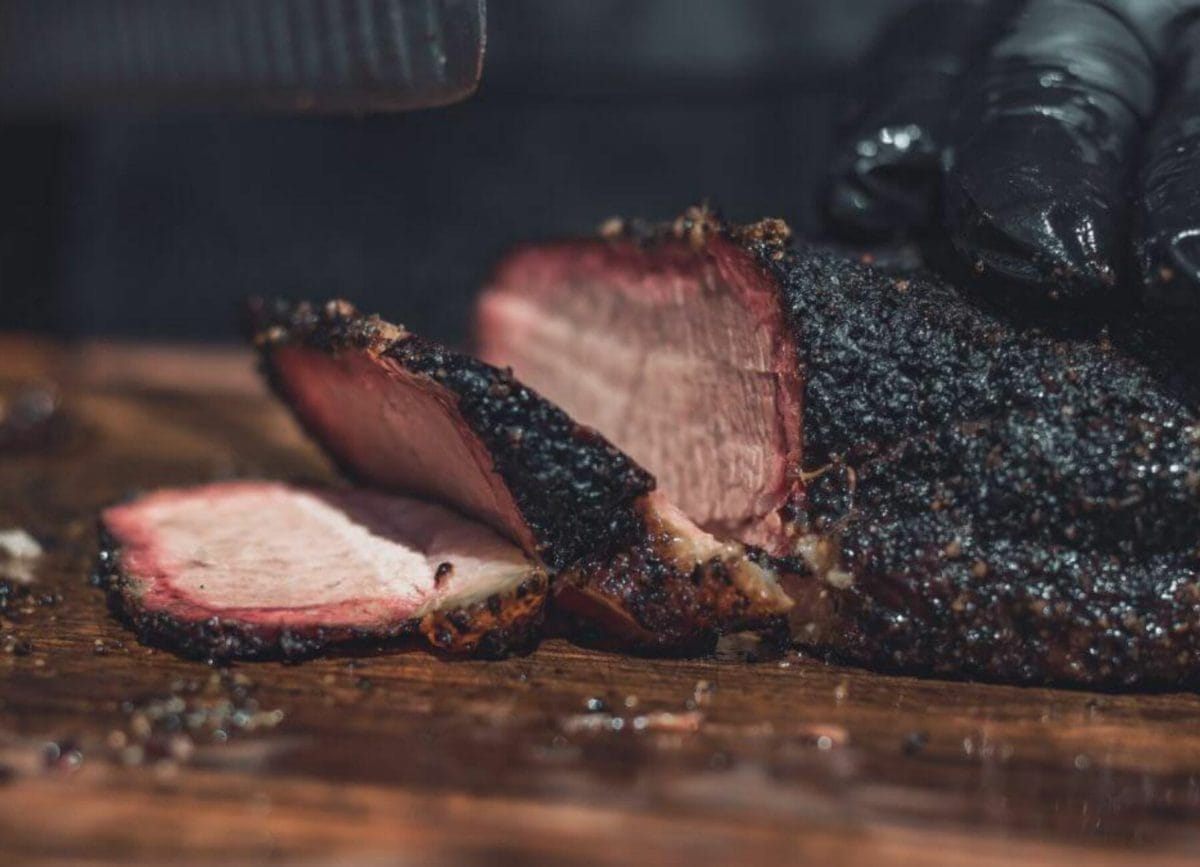 Shows a close of a smoked beef brisket being sliced, things to do in Orlando