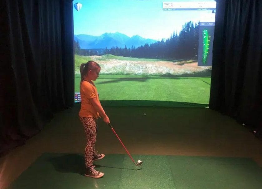Playing golf indoors at the Village Hideaway