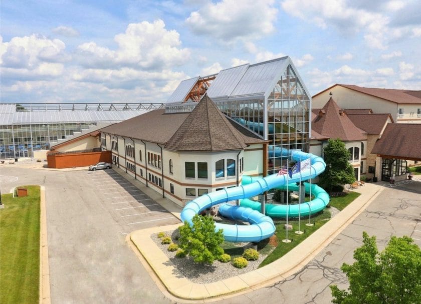 Shows an exterior view of Zehnder's Splash Village including the large looping water slide, indoor water parks in Michigan