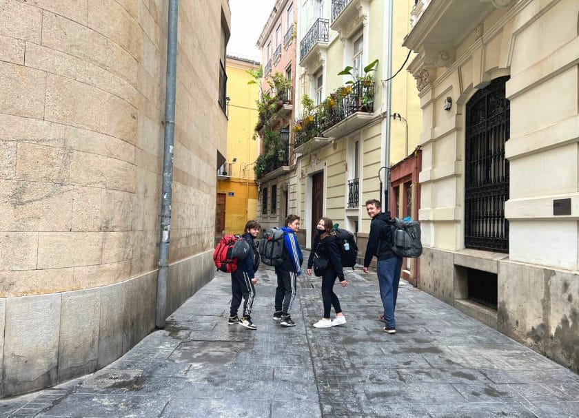 Backing Europe walking down street in Valencia