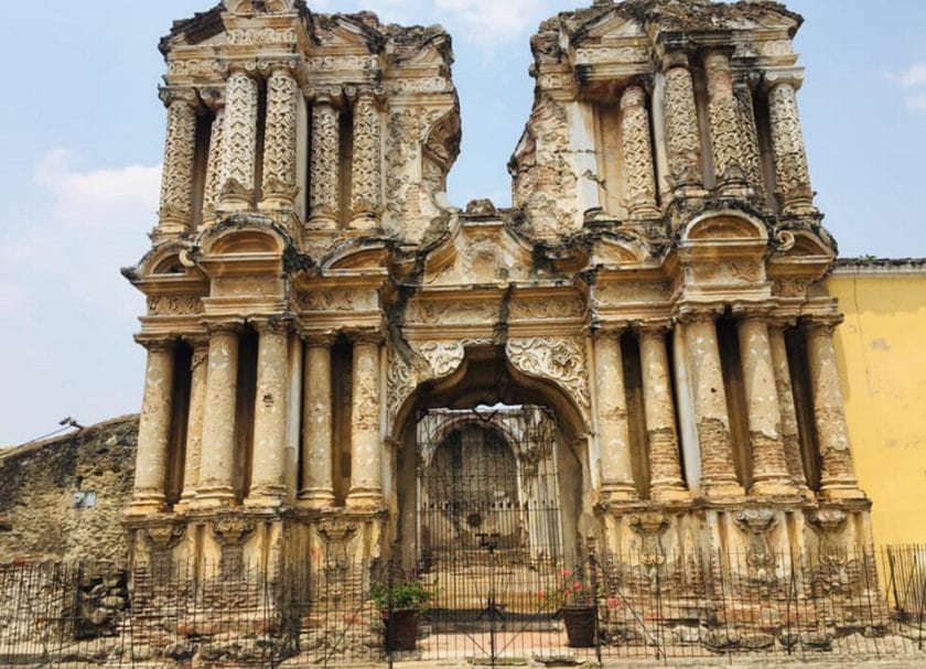 Shows the majestic ruins of El Carmen behind a fence in Antigua, Guatemala, Things to do in Antigua Guatemala
