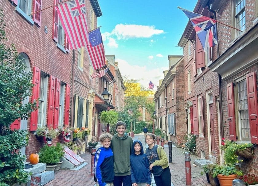 Picture of kids standing on this picturesque cobblestone street, Things to do in Philadelphia with kids