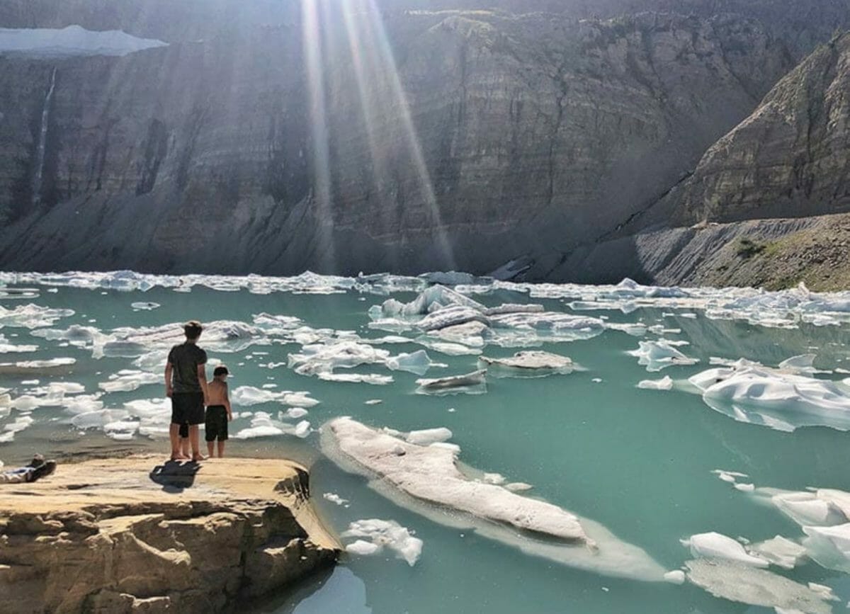 Kids standing to the Lake watching glaciers float by