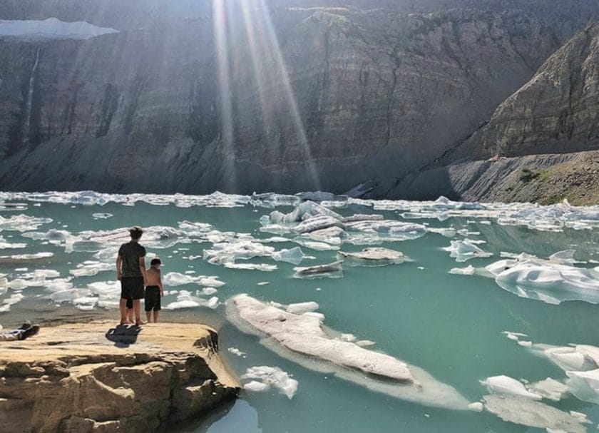 Kids standing to the Lake watching glaciers float by
