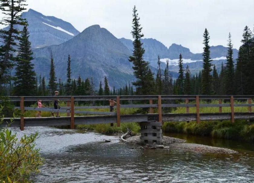 Kids walking over the bridge at Grinell Lake, Things to do in Many Glacier