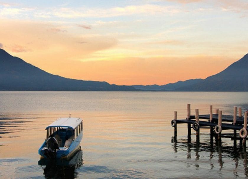 Shows a boat traveling across Lake Aititlan in Guatemala, Things to do in Antigua Guatemala