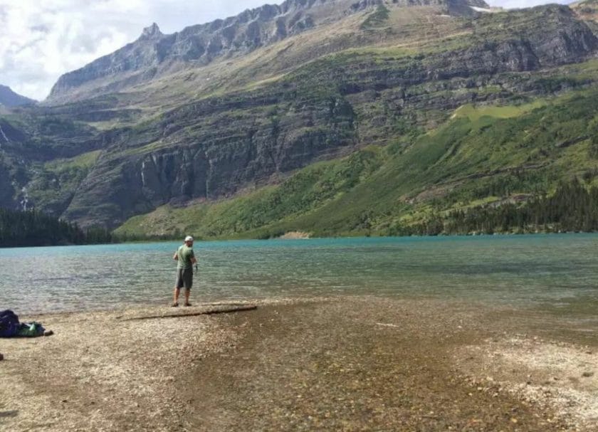 A man standing next to Grinnell Lake, Things to do in Many Glacier