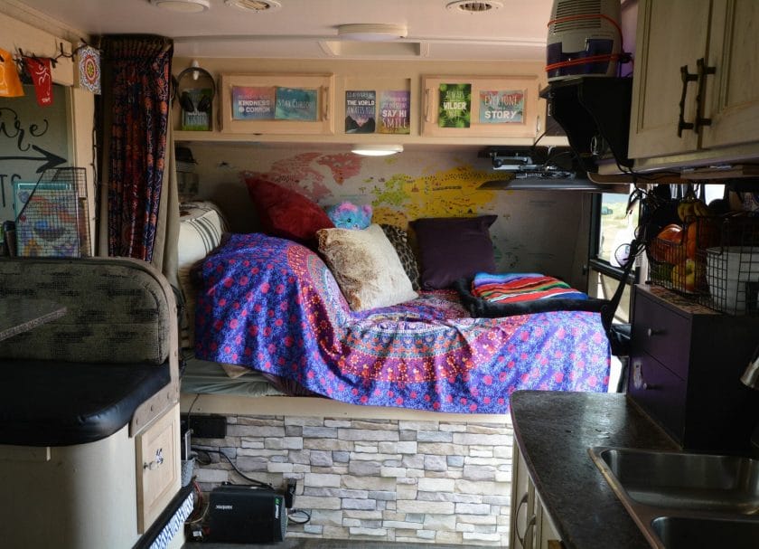 This pic shows a TV locked into place above a bed in an RV, Best RV TV Mounts