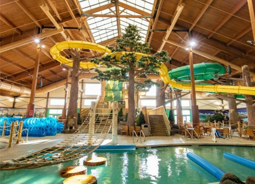 Shows a view looking at the large water slides and rope bridge at Timber Ridge Indoor Water Park Wisconsin