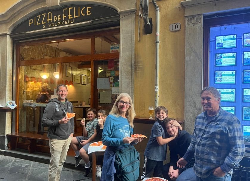 Eating pizza in Lucca
