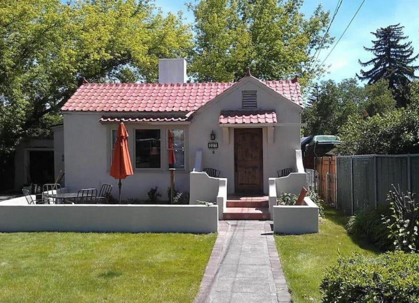 Shows an exterior view of a 1920s cute bungalow in Bend Oregon