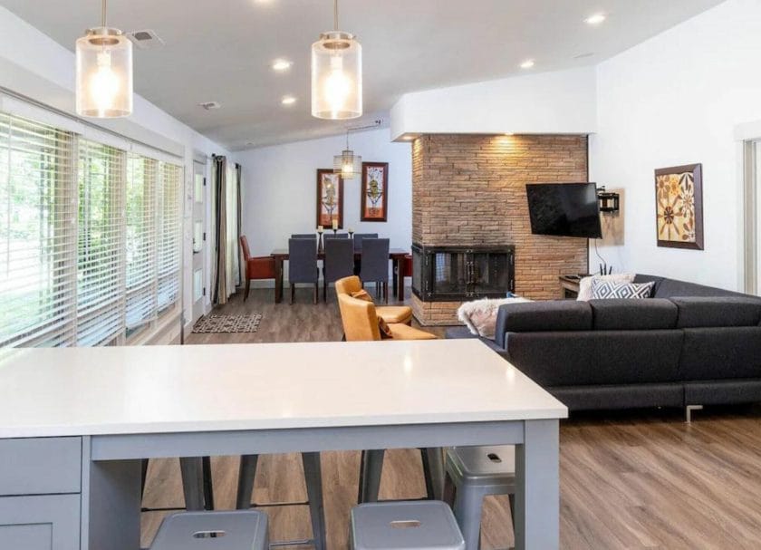 Shows the living space and fireplace in the renovated downtown riverfront home.