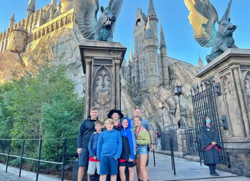 Shows the family standing in front of Harry Potter and the Forbidden Journey, Harry Potter World Rides