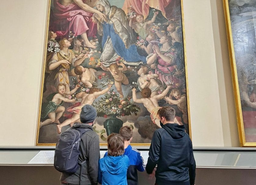 Looking at art at the Accademia Gallery in Florence, Italy