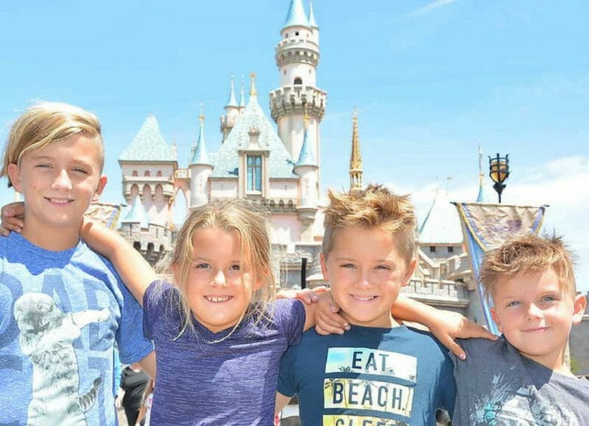 4 Kids smiling at Disneyland