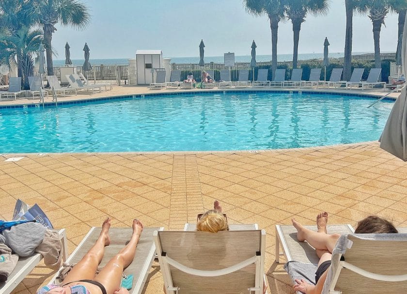 Sitting by the Clubhouse Pool at The Resort