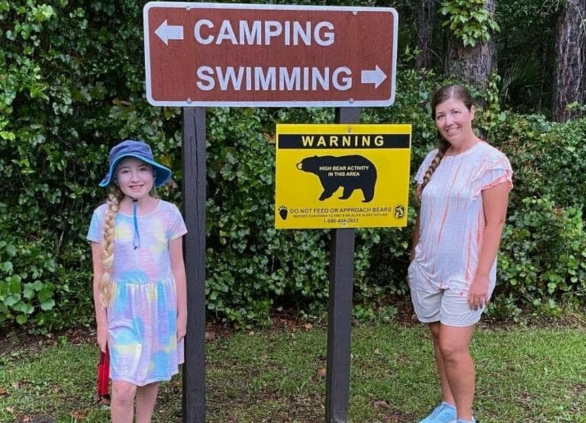 Woman And Girl With Bear Sign In Florida's Ocala National Forest, best springs in Florida