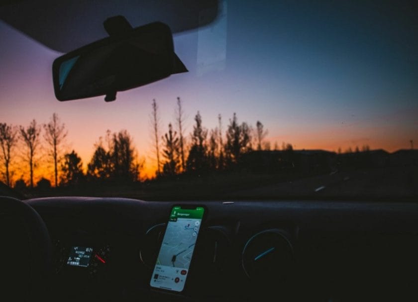 Shows someone driving at sunset with the GPS on, RV apps that are super helpful