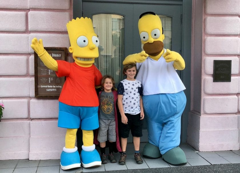 2 kids posing with Bart and Homer Simpson, Universal vs Islands of Adventure
