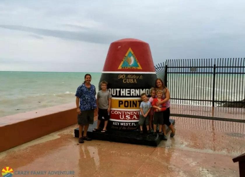 A family standing at the Southernmost Point in Key West, Things to do in Key West