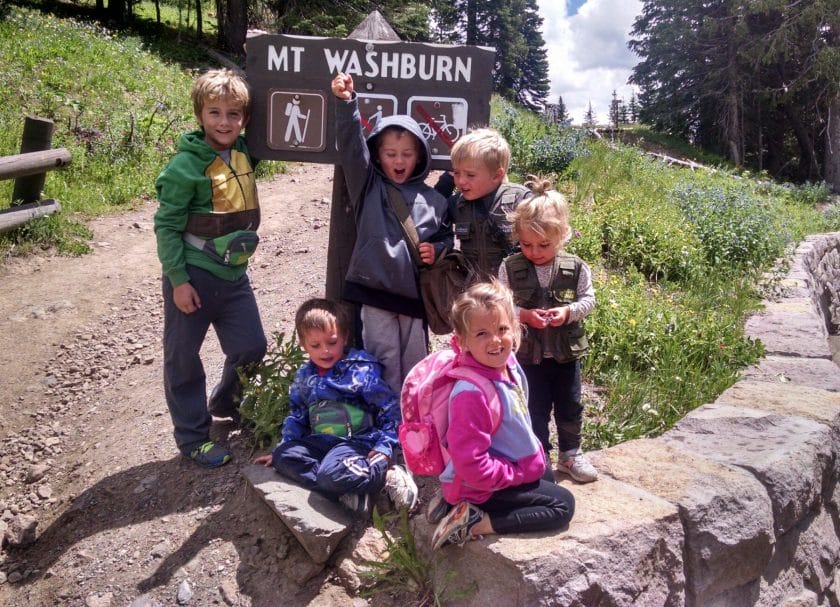 Kids standing by the Mount Washburn sign ready to go hike!
