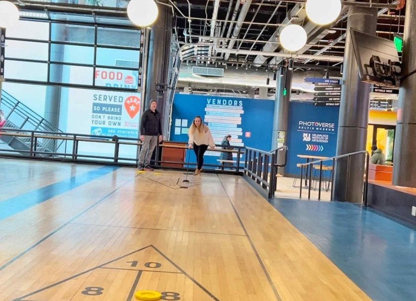 Craig and I playing shuffle board at the 3rd street market in Milwaukee