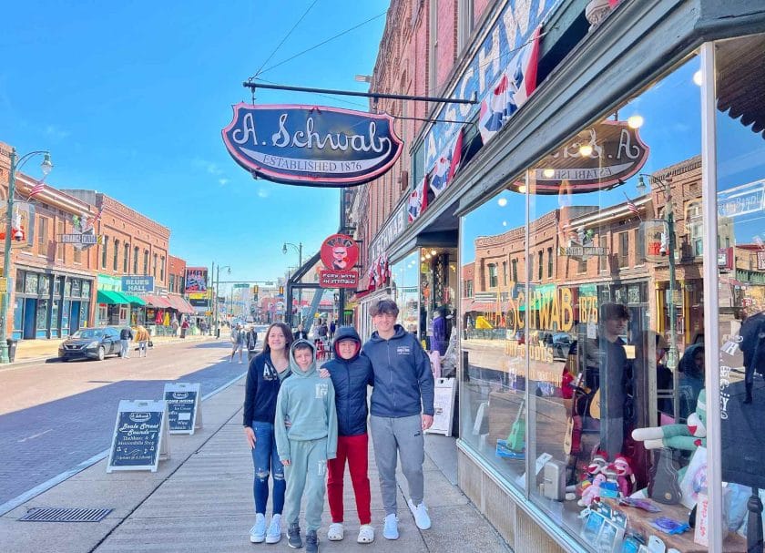 Kids standing outside of the A Schwab restaurant on Beale Street. 