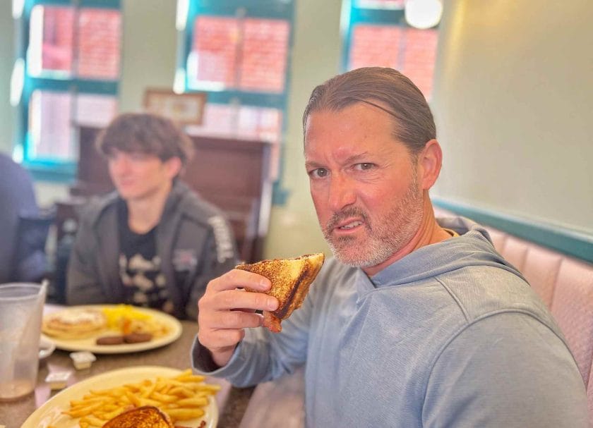 Craig eating a banana and peanut butter sandwich at the Arcade Restaurant.